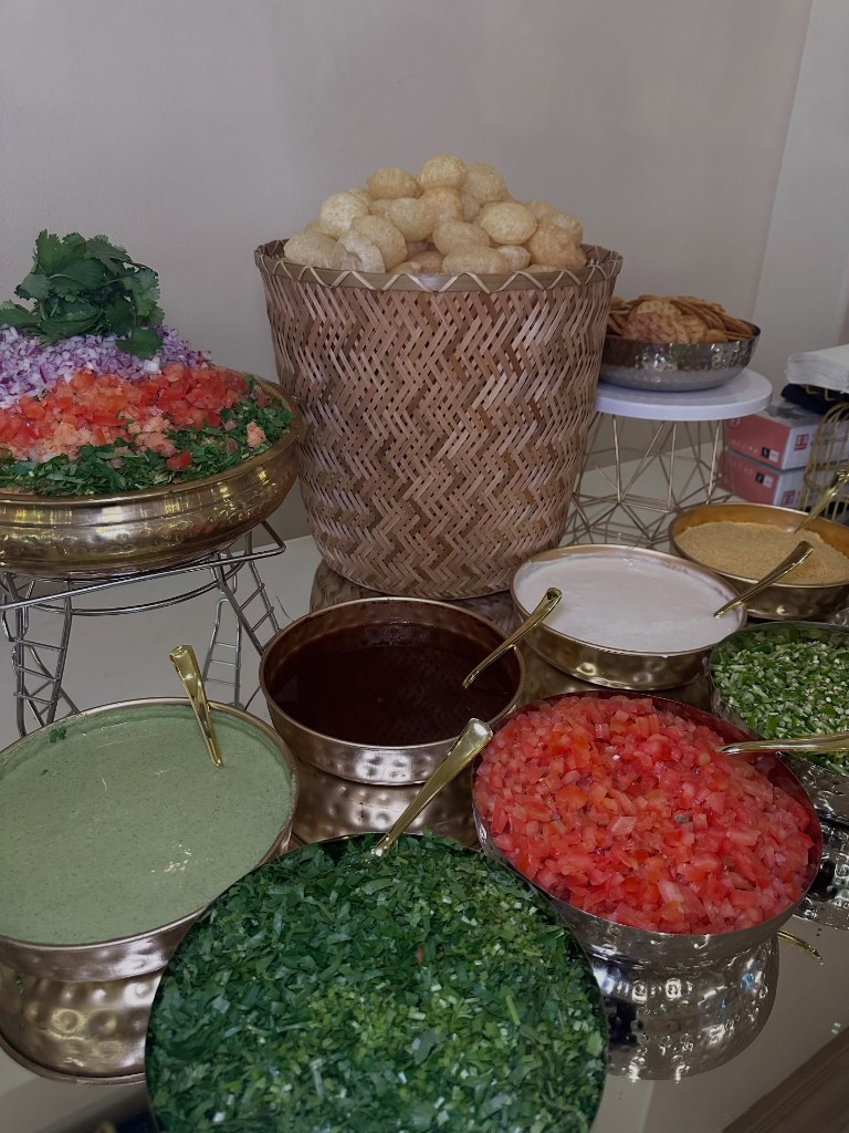 Live pani puri station with chutneys and fresh chopped toppings