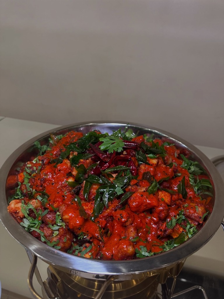 Spicy paneer tossed with curry leaves, mustard seeds and dried chilis